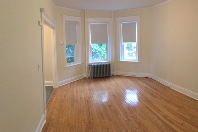 Visit hubrealtyproperties.com - Freshly painted studio with refinished hardwood floors and new kitchen