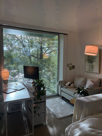 Bedroom 2, with sofa and river view. - 10 Akron 1BR Convertible — 2 Private Rooms, Furnished | May 15–Jul 9
