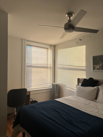 Bedroom bed, desk, and window - 91 Westland Ave Newly Renovated Unit (2BR 1BA) Apartments