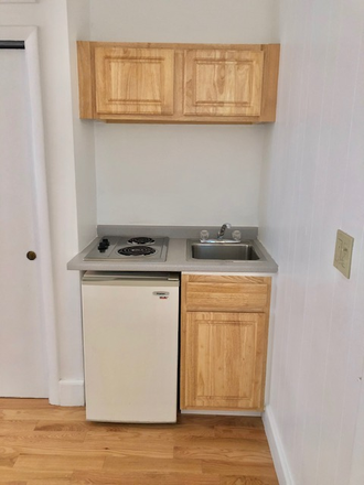 Visit hubrealtyproperties.com - Popular Newbury St furnished studio with large bay windows Apartments