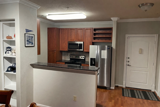 Fully equipped kitchen with stainless steel appliances. - Fully Furnished 2 Bed/2 Bath Condo, Includes All Utilities and Fees