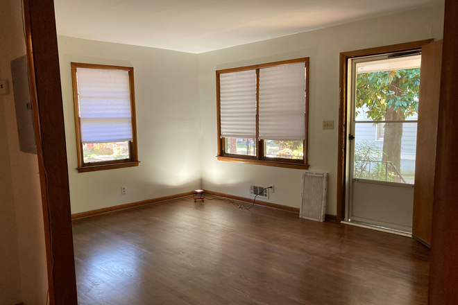living room with main entry door at front covered porch - great little apartment in a walkable neighborhood with lots of trees, restaurants and shops