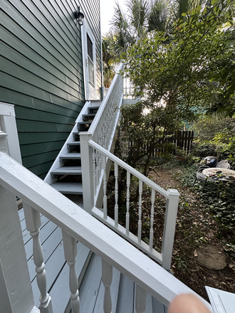 Back stairs and small yard which will be cleaned up - HARLESTON GREEN TH AVAILABLE AUGUST 1, 2026 Townhome