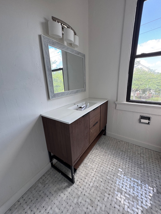 Upstairs bathroom with marble flooring and bath/shower - 4 bd/2 bth house with fenced in yard, w/d, hardwood floors, fireplaces & fully renovated bathroo
