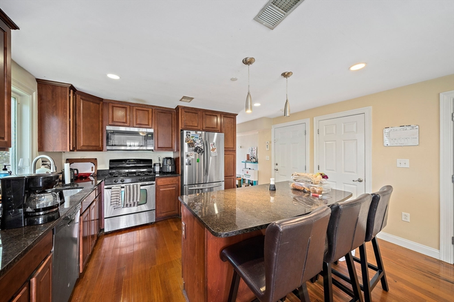 LIVING - STUNNING 4 BED/2.5 BATH WITH PARKING AND IN UNIT LAUNDRY!