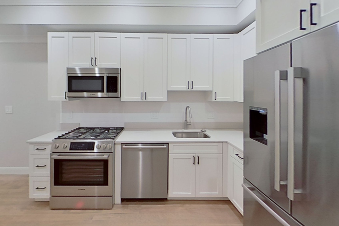 Visit hubrealtyproperties.com - Newly renovated 2 bedroom with high end appliances, laundry in unit