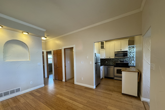 Living room looking in to kitchen - Cozy 2 Bedroom Unit in RiNo Townhome