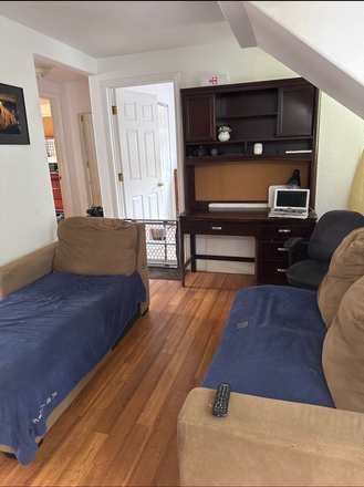 Living room - Private room in a two-bedroom unit downstairs located in a quiet neighborhood close to campus Apartments