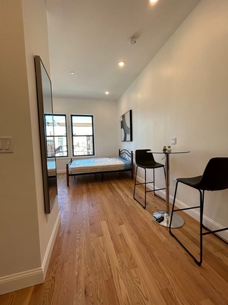 Lots of light coming in from the windows - RENOVATED  SPACIOUS  STUDIO w/ TRANSIT ACCESS (30min to Emerson) - SUBLET AVAILABLE JULY Apartments