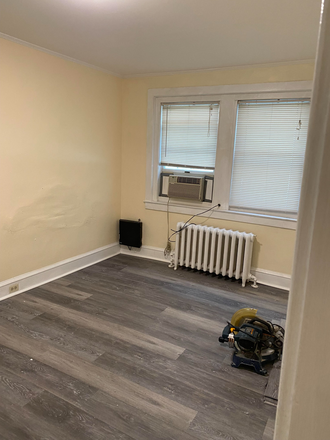 New floors in the living room. AC units in every room. - Kuranda Mortgage Building Apartments