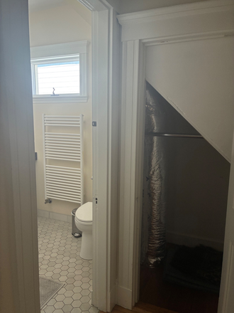 Front Hall Closet and Bathroom Doorway - 4 Bedroom Apartment near Gilman Square Green Line Station