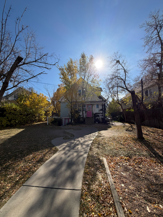 Backyard, very spacious and has parking spaces for you - Housing on the Hill Townhome