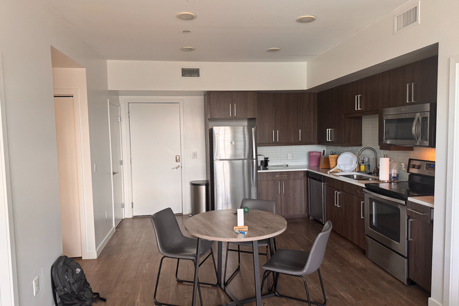 View of kitchen from living room - Union 9Seventy Apartments
