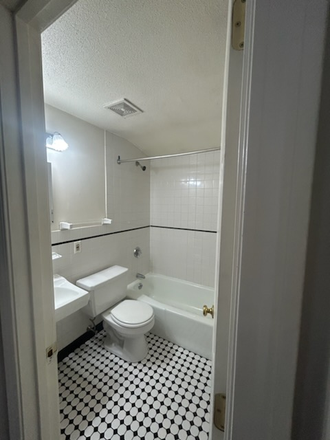 tile bathroom with tub and shower - Avail 7/1/27 Cozy two bedroom great for 2-4 people in the center of town Apartments