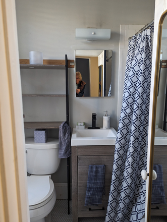 Bathtub with Shower - Location Location Location! Apartments