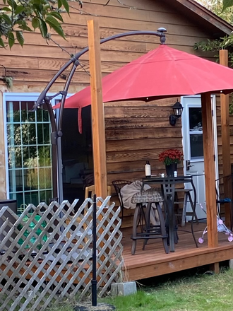 Deck, studio door, bathroom door. - Snug Studio near bike path to campus. House