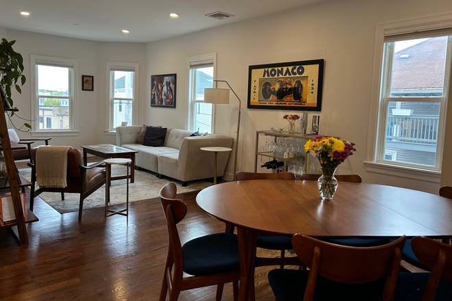 Living Room/Dining - Spacious, Renovated Condo with Patio and Parking