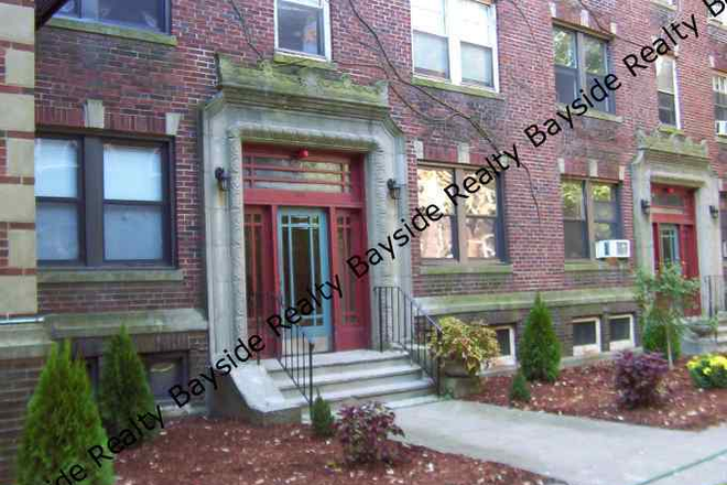 front - fantastic location! charming small brick building Harvard design