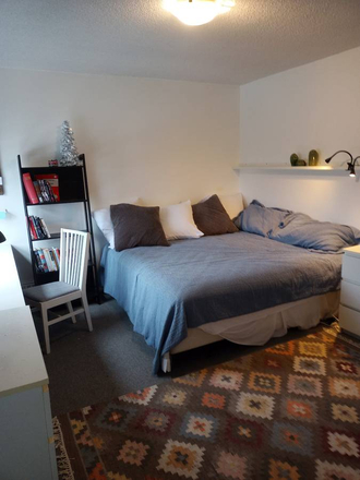 View of bed in master bedroom - Yonge & Davisville: master bedroom with private bathroom in shared-accommodation 15 min to U of T