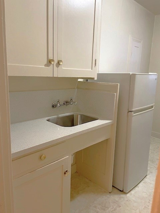kitchen - This simple studio is in a great location just a block from campus on the northwest end Apartments