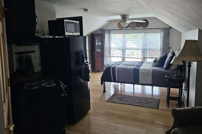 Bedroom area including TV - Comfortable Furnished Studio 3rd floor Apartments