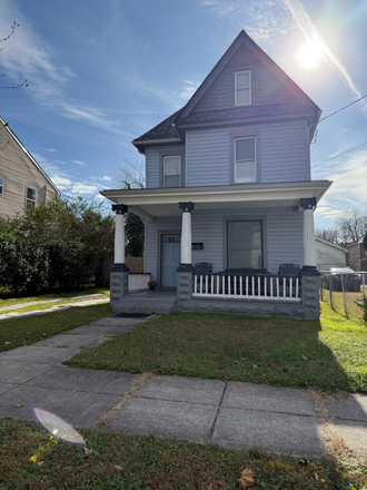 Front of house - Big Blue 4 bed, 2 bath, furnished house. Utilities included