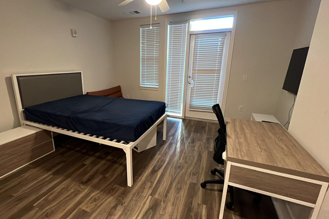 Bed facing Patio - Fully Furnished Union Blacksburg Studio Apt. with Patio and walkable to VT Campus, next to Kroger