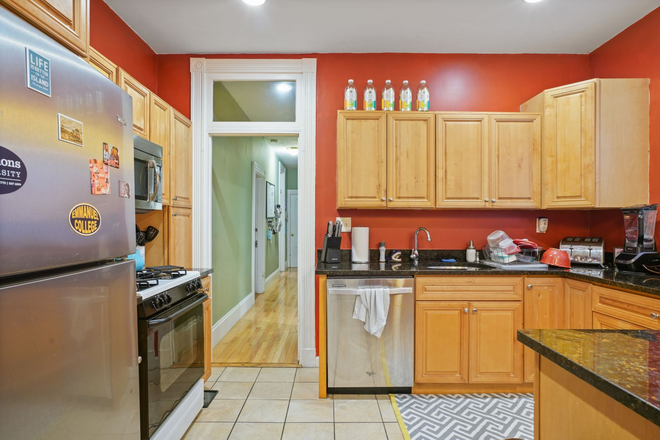 Kitchen - Spacious 4-Bedroom with High Ceilings, In-Unit Laundry & Modern Kitchen! Apartments