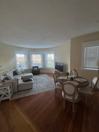 Living room - Opening in spacious 2 bed/1 bath close to Harvard Ave B line stop! Apartments