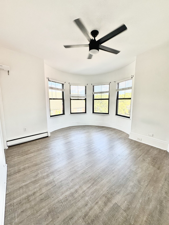 Living Area - Modern 4 Bed in Mission Hill - Laundry in Unit - Pet Friendly! Apartments