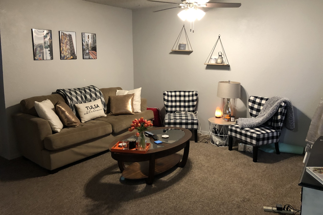 Living Rm - Eagles Nest Apartments. Half a block away from the center of campus/Student Union!