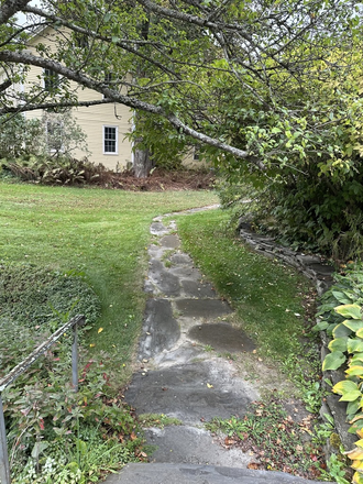 Walkway to Main House - The Cottage at Sabra's Place Apartments