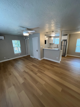 Open plan living area into kitchen with dining - Recently remodeled 704 sq ft Montrose Garage Apartment