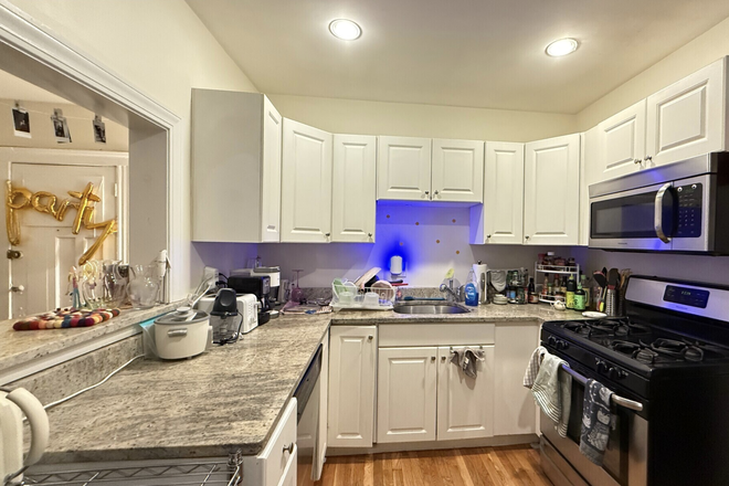 living - STUNNING 4 BED WITH HEAT/HOT WATER INCLUDED, NO BROKER FEE! AVAIL 9/1/26!!