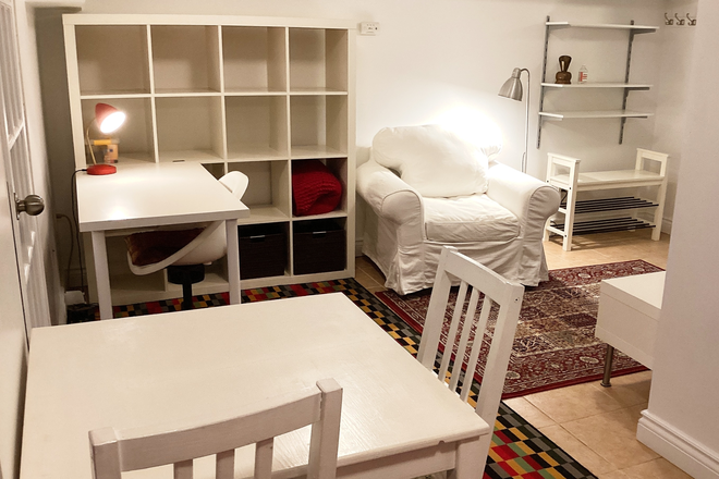 Dining table and sitting area - Furnished Basement Studio apartment,  Bloor and Ossington