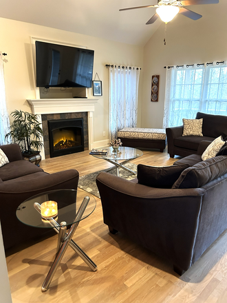 Living room with fireplace and big screen TV - Fully furnished! Move In Ready! 3 bedroom 2.5 Bath Huge Bonus Room 5 miles from AU House