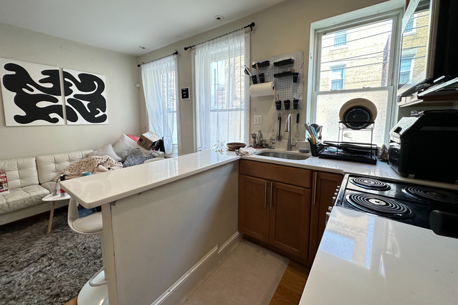 kitchen - Modern 4 bed/2 bath duplex with AC, deck and in unit laundry - no fee! Apartments