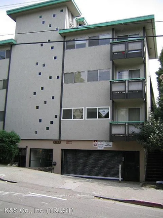 Outside of the building. - 2 bedroom, 2 bathroom cozy, carpetted apartment close to campus