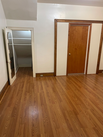 Apartment bedroom closet on left and door leading into Common Area with lock. - 615 South 42 Street.  Apartment with backyard, convenient location USP, Penn and Drexel and public t
