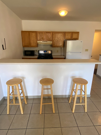 Bar- separating living room and kitchen - 4/5 Bed, 2 Bath, Beautiful Common Areas, In-Unit Laundry, Central Air, IN Patrol Zone, Big Bedroom Apartments