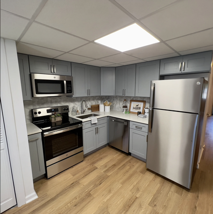 Kitchen - The Den at Cedar Ridge Apartments