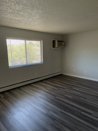 Living Room Two-Bed Remodeled - One, Two, and Five Bedrooms On Johnson Apartments