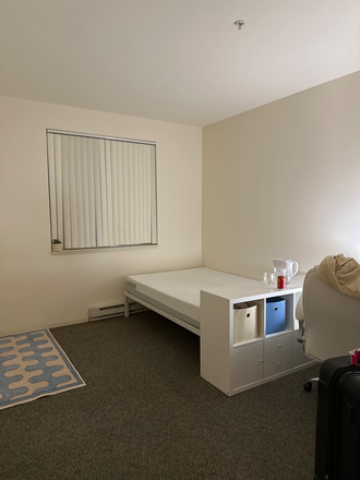 Bedroom with a bed, drawers, desk and a chair. - Female Only Sublease [2B/2B] One Private Bedroom + Bathroom