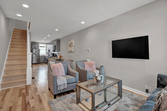 Living room - Live comfortably & walk to Johns Hopkins - everything you need in a furnished townhome.