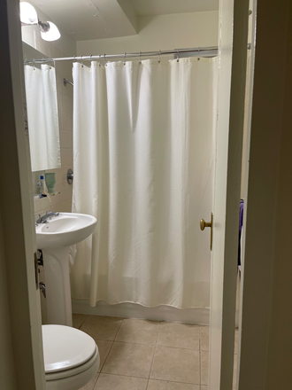 Bathroom with storage mirror - Cute apartment with view of Stuytown Park from window