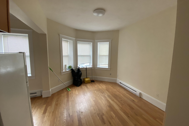 Visit hubrealtyproperties.com - Excellent 2 bedroom with newly updated kitchen and breakfast bar, on the green line T Apartments