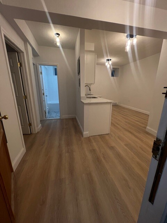 Living Space - 2-bedroom unit close to campus w/ recently renovated kitchen! Apartments