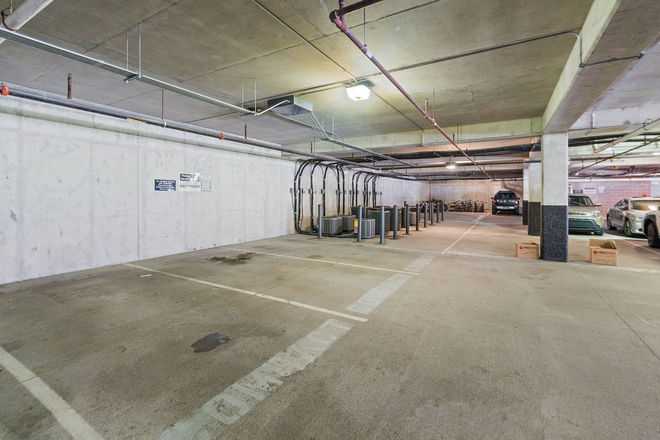 Two assigned parking space in secure underground garage with security - The Glen
