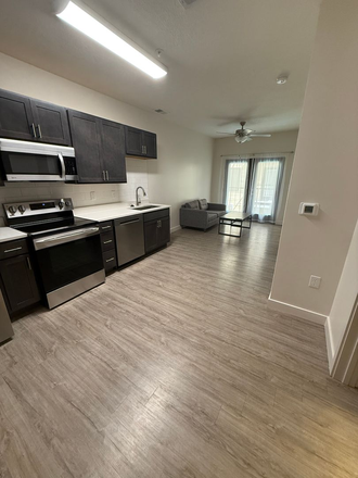 Kitchen and Living Space (taken in a 1 bedroom, but fixtures are the same) - Monterey Apartments by Evergreen