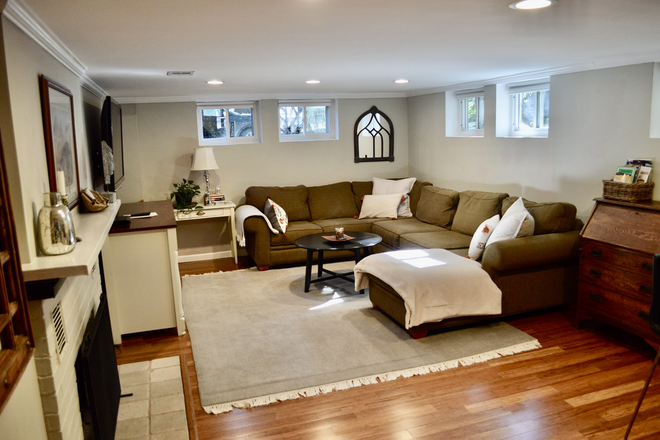 Open plan living room and kitchen area - Walk to Campus. Large garden level, 1-bedroom, furnished apartment with open plan kitchen living.